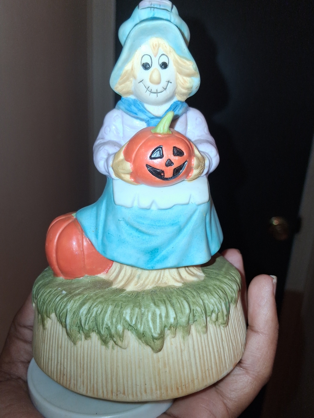 Vintage porcelain or ceramic Halloween musical figurine.
